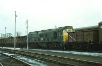 25009 backs onto a freight in Elgin goods yard in February 1979<br>
<br><br>[Peter Todd 08/02/1979]