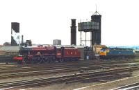 Preserved Jubilee 4-6-0 no 5690 <i>Leander</i> rests alongside 47471 at the stabling point outside Leeds station in April 1982 after working in on the first leg of the Northwich - Leeds - Carlisle <I>Trans Pennine Pullman</I>.<br><br>[David Pesterfield 10/04/1982]