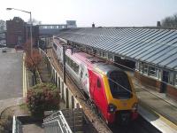 View south over Berwick station from Castlegate Bridge on 17 April 2003 with a Virgin Voyager at the platform.<br><br>[James Young 17/04/2003]