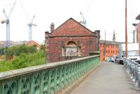 A Sunday morning stroll through Partick on 27 August 2006 heading north across Benalder Street bridge, with the River Kelvin and the abandoned platforms of Partick Central* (1896-1964) below.  The developers' cranes seem to be closing in on this area of the city and the building would only survive for another 5 months [See image 13369]. (*The old station was renamed Kelvin Hall for the last 5 years of its operational life).<br>
<br><br>[John Furnevel 27/08/2006]