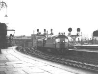 A type 2 arrives at St Enoch with a passenger train (origin unknown) on the final day of operations. This may well have been the last locomotive - hauled passenger train to enter the station.<br>
<br><br>[Colin Miller 26/06/1966]