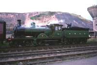 Ex-GNSR 4-4-0 no 49 <I>Gordon Highlander</I> stands alongside the Ramsay Colliery, Loanhead, with the BLS railtour of 16 October 1965. The 3-coach railtour, hauled by no 49 throughout, ran from Glasgow Central and included a trip along the Roslin branch, incorporating this stop. The train returned to Glasgow via Bathgate to terminate at St Enoch. [Ref Query 3138]<br><br>[Robin Barbour Collection (Courtesy Bruce McCartney) 16/10/1965]