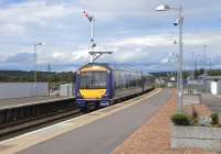 170 417 pulls into Montrose with a service for Edinburgh on 18 June, while the lofty MN [Montrose North] 44 is set for a northbound train.<br><br>[David Panton 18/06/2009]