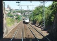 Southbound TGV No. 316, as seen from the front end of a local DMU approaching Angouleme station, which lies immediately beyond the tunnel under the town. <br><br>[Mark Bartlett 23/06/2009]
