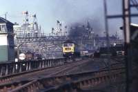 The 1015 hrs Aberdeen to Kings Cross hauled by a Class 47, leaves a plume of black smoke as it approaches Ferryhill SB on a sunny morning in the early 1970s.<br><br>[John McIntyre //]