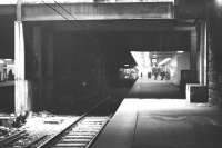 A Milngavie service calls at the westbound platform at Glasgow Queen Street station in the 1970s. The eastbound platform can just be seen beyond the separating wall on the left.<br><br>[John McIntyre //]