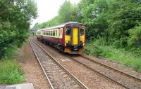 A train for East Kilbride approaches Clarkston in July 2009.<br><br>[John Steven 01/07/2009]