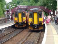 Services for East Kilbride and Glasgow Central meet at Clarkston on 1 July 2009.<br><br>[John Steven 01/07/2009]