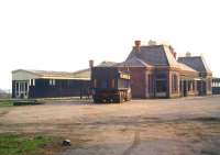 Late afternoon sunshine lights up the abandoned station at Ross-on-Wye. Photographed from the old station approach road in 1974, some 10 years after closure [see image 36288].   <br><br>[Colin Miller //1974]