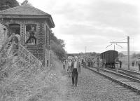 The BLS <I>Lothian and Fife Wanderer</I> railtour calls at Bogside, Fife, on 23 August 1980, at that time the end of the line from Dunfermline. Two gunpowder vans stand in the siding opposite the old signal box (a <I>sealed</I> version of which still stands alongside what is now a walkway/cycle path) [See image 11082]. Bogside lost its passenger service in 1958, although freight continued for several years. Official closure of the line between Bogside and Oakley came in 1982.  <br>
<br><br>[Bill Roberton 23/08/1980]