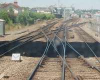 3 double slip crossovers form part of a complicated approach to Saintes as seen from the front of an S.N.C.F. DMU from Angouleme that is routed into the far left platform. Here it will reverse for the branch to Royan. Saintes train maintenance and repair depot is on the far right, opposite the station.<br><br>[Mark Bartlett 23/06/2009]