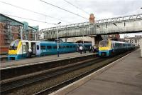 Arriva Trains Wales services passing at Manchester Oxford Road on 8 July 2009. On the left is 175107 heading to Manchester Piccadilly (having originated in Llandudno) whilst on the right is 175113 with a service for Chester.<br><br>[John McIntyre 08/07/2009]