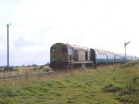 A Hull - Bridlington train near Lowthorpe, north of Driffield, in August 1979. During its early years, locomotive 20103 was one of the large batch of EE Type 1s allocated to Eastfield shed  (well over 40 in the mid 1960s). Note the housing on the cabside that once accommodated a tablet catcher.<br>
<br><br>[Peter Todd /08/1979]
