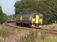 A Glasgow bound Class 156 pulls out of Livingston South with an evening service from Edinburgh in 2004<br><br>[James Young 09/09/2004]