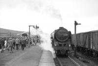 The LCGB <I>Thames-Tyne Limited</I> railtour of 3 June 1967, stands at Hellifield, behind no 70039 <I>Sir Christopher Wren</I>. The Britannia took the train to Carlisle via the S&C.<br><br>[Robin Barbour Collection (Courtesy Bruce McCartney) 03/06/1967]