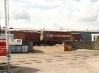 Entrance to the EWS depot at St Phillips Marsh, Bristol, on 10 July, with 08516 standing just beyond the barrier.<br><br>[Peter Todd 10/07/2009]