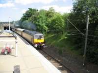 In order to turn the set so that the class 87 would be leading heading back south, the 'Electric Scot' railtour did a spin around the Cathcart Circle headed by Class 47 no 47786 'Roy Castle OBE'. 87002 was dead in tow at the rear.<br><br>[Michael Gibb 11/07/2009]