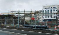 Whitburn Road bridge has been temporarily removed. This photograph is taken from the temporary road to replace it. The new bridge is under construction and the preparation of the trackbed can be seen on the right. View looks to Airdrie.<br><br>[Michael Gibb 12/07/2009]