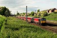 Memories of the way it used to be on the WCML with a Vigin liveried Class 87 at the head of a southbound service on the Up Slow line just south of Farington Curve Junction.<br><br>[John McIntyre 22/05/2004]