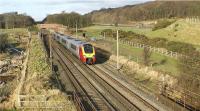 A southbound Voyager at Woodacre just south of Scorton on a service from Scotland to Birmingham New Street on 24 January 2009. The M6 motorway can be seen to the right of the photo however the road vehicles are no match for the Voyager.<br><br>[John McIntyre 24/01/2009]