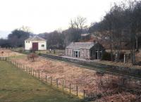 Looking over the old station and goods shed at Blacksboat on the Strathspey line. View from the road bridge in March 1991. The trackbed now forms part of The Strathspey Way.<br><br>[Peter Todd /03/1991]