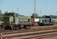 Mixed traffic SNCF diesel 63786, dating from the 1950s, makes up its freight train in Saintes yard as seen from the station platforms. Behind is another, slightly younger, locomotive 66130 that is stabled between duties. Being France, once the train was ready to go the crew trooped off for lunch. [See image 24621] <br><br>[Mark Bartlett 23/06/2009]