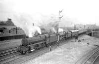 Black 5 no 45431 and Jubilee 45643 <I>Rodney</I> double head a WCML service south out of Carlisle in the early sixties with the train having just crossed the bridge over the goods lines. In the background a DMU can be seen running from Currock Junction towards Citadel station and in the bottom right of the picture is one of the lines leading into Crown Street goods depot.<br><br>[Robin Barbour Collection (Courtesy Bruce McCartney) 05/07/1958]