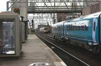 Looking west along Platform 1 at Oxford Road station on 08 July 2009 as an ATW Class 175 waits in Platform 2 with a service to Chester and an eastbound FTPE Class 185 approaches with a Manchester Airport Service.<br><br>[John McIntyre 08/07/2009]