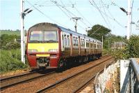 Having just crossed Geilston LC, 320301 approaches Cardross with a Glasgow bound service in the evening of 30 May 2009.<br><br>[John McIntyre 30/05/2009]