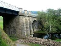 The substantial bridge that brought the railway across the Lyne Water into Lyne Station. Looking east over the river towards Peebles in September 2002, with the old station (now a secluded private residence) off picture to the left.<br><br>[John Furnevel 19/09/2002]