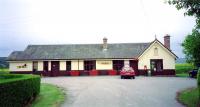 The former station at Redcastle on the Fortrose Branch viewed looking south. The station was closed to passengers in October 1951, while the Muir of Ord - Fortrose line closed completely in 1960. Redcastle station building was refurbished in the 1990s and incorporates a Post Office and shop. [See image 24702]<br>
<br><br>[Peter Todd Collection //]