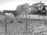 The truncated branch that once served Inverhouse distillery, seen looking back to Moffat Mills Junction on 21 February 1988. Running off to the right is the remains of the Airdrie - Bathgate line, which terminates just out of the picture. [See image 24624] <br><br>[Bill Roberton 21/02/1988]