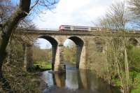 A Dunblane - Glasgow Queen Street service crosses the River Carron just south of Larbert station in April 2006. <br><br>[John Furnevel 26/04/2006]