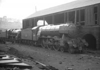 A despondent looking Gresley A3 Pacific no 60090 <I>Grand Parade</I>, minus nameplates, stands alongside the old coaling stage at Eastfield shed. One of the locomotives transferred to 65B St Rollox in its twilight years to operate the 3 hour Glasgow - Aberdeen services, the photograph is thought to have been taken in the Autumn of 1963, following the A3s withdrawal from 65B and a short time before being cut up at nearby Cowlairs in January of 1964.<br><br>[K A Gray //1963]