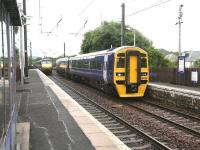 The Saturday morning 0825 Edinburgh - Glasgow via Shotts service arrives at Kingsknowe station on 18 July formed by 158786. In the background, is the rear of the National Express 0650 Glasgow Central - London Kings Cross train, with its next stop at Haymarket. The appearance of the 158 as opposed to the usual 156 on this route was due to the latter being utilised on Glasgow - Girvan <I>Golflink</I> specials on the occasion of the 138th Open Championship at Turnberry.     <br><br>[John Furnevel 18/07/2009]