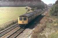 Mixed DMU working a Blackpool (August Bank Holiday weekend) service in 1982. The seven coach train comprises a Class 105 Cravens, A Swindon Class 120 3-car and a Derby Class 108. Although I had gone to this spot to photograph the loco hauled Saturday extras I'm glad I also captured this unusual formation for posterity. <br><br>[Mark Bartlett 28/08/1982]