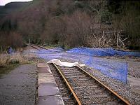 Stromeferry looking towards Inverness. On the 29th of October 2001 a mudslide closed the Kyle line making Strathcarron the temporary terminus until the line was remade east of Stromeferry. The hillside was cleared, made stable and a new formation built. A temporary level crossing was made at the east end of Stromeferry station (shown here) and an enormous mound of spoil was built up at the closed Howard Doris sidings site.<br><br>[Ewan Crawford 10/02/2002]