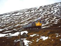 The morning train from Fort William to Glasgow Queen Street approaches a cold and snowy Corrour Summit in the winter of 1974/5.<br><br>[John Robin 14/12/1974]