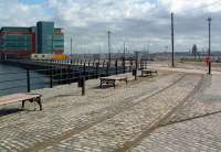 Looking south towards the site of Liverpool Riverside station in July 2003. The Cammell Laird shipyard can be seen across the Mersey in Birkenhead and Princes Dock stands on the left. [See image 24714]<br><br>[Ewan Crawford 11/07/2003]