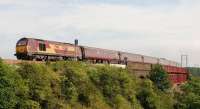 EWS 67025 comes off Jamestown viaduct on the approach to Inverkeithing on 25 June with the 1708 Fife Circle service from Waverley. <br><br>[Andy Carr 25/06/2009]