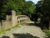 West of Dalchonzie Halt this bow girder bridge carried the railway over the River Earn. The view is looking east towards Dalchonzie Halt in the distance. The trackbed from here almost to St Fillans looks to be in walkable condition.<br><br>[John Gray 25/07/2009]