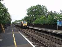 The period style lighting adds a nice touch to Tackley station as a Cross Country Voyager speeds south on the line from Banbury to Oxford. This view looks north towards Banbury.<br><br>[Mark Bartlett 18/06/2009]