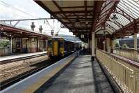 The 1037 hrs Saturdays only service from Glasgow Queen Street to Oban calls at Dumbarton Central on 25 July 2009.<br><br>[John McIntyre 25/07/2009]