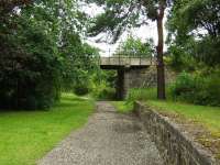 This platform and bridge are all that remains of the once busy junction station at Craigellachie. This was the Speyside Line platform with trains leaving here for Boat of Garten.<br><br>[John Gray 27/07/2009]