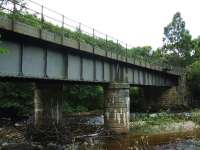 The trackbed from Craigellachie to Dufftown is now part of the Speyside Way and this viaduct over the River Fiddich is at the east end of the station site right at the start of the walk, a steady climb of about four miles. A small platform attached to the structure still has some surviving signal pulleys.<br><br>[John Gray 27/07/2009]