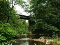 It is a steady climb from Craigellachie to Dufftown and, after about a mile and a half, the River Fiddich is crossed by this viaduct which is numbered 240.<br><br>[John Gray 27/07/2009]