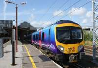 Having just combined with a 3 car set from Glasgow, 185123, which had formed the 1618 hrs service from Lancaster, now heads the 6-car train out of Preston on the final leg of a service to Manchester Airport.<br><br>[John McIntyre 27/07/2009]