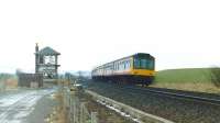 A DMU coastbound passing the derelict Beith North signal box in 1986.<br>
<br><br>[Colin Miller //1986]