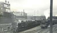 EE Type 4 no D269 of Crewe shed with the 1005 Glasgow Central - Birmingham New Street passes Black 5 no 45136 on ECS at Gushetfaulds Junction on 9 June 1962. <br><br>[Ken Browne 09/06/1962]