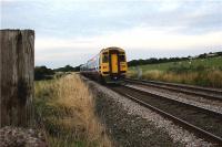A Blackpool North to York service is seen heading east in fading light from Gregson Lane UWG on its way towards Hoghton and Blackburn at 2050 hrs on 2 August 2009.<br><br>[John McIntyre 02/08/2009]